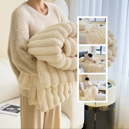 Person holding a beige knitted blanket with inset images of its use.